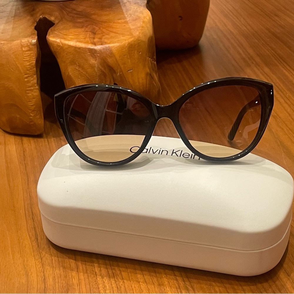 Calvin Klein Crystal Brown sunglasses. Very chic! Brand new with tags and case.